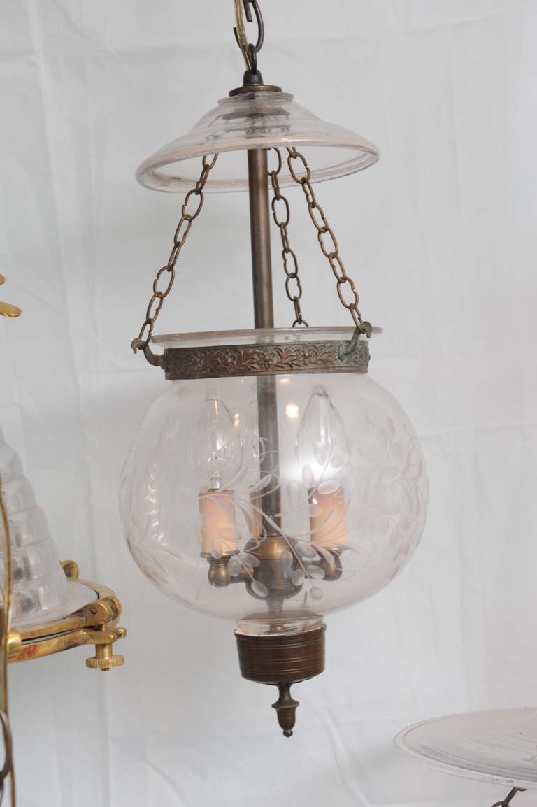Late 19th C. hand blown English hall lantern with smoke cap and vine etching along the globe shaped lantern, complete with original brass hardware.  Originally used for candles, this has been electrified for American use and takes 3 candelabra bulbs.