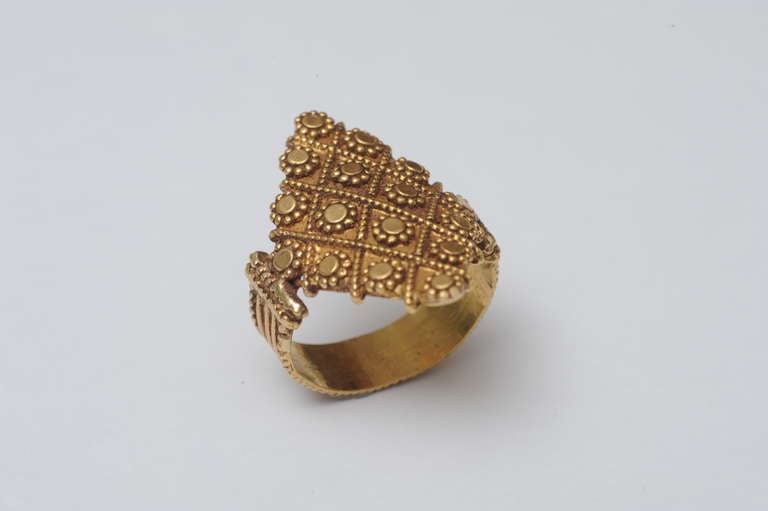 This is beautifully crafted 22K gold ring with fine granulation work and reeded band.  C. 1940's.  Size is 6.5.

Fine Indian jewelry located on Nantucket Island.