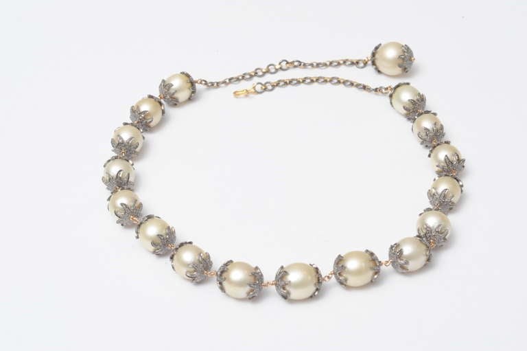 Beautiful and intricate necklace of south sea pearls with pave' set diamonds set in oxidized sterling bead caps and connected with 18K gold wire.  The chain along the back allows the length to be adjustable from 17
