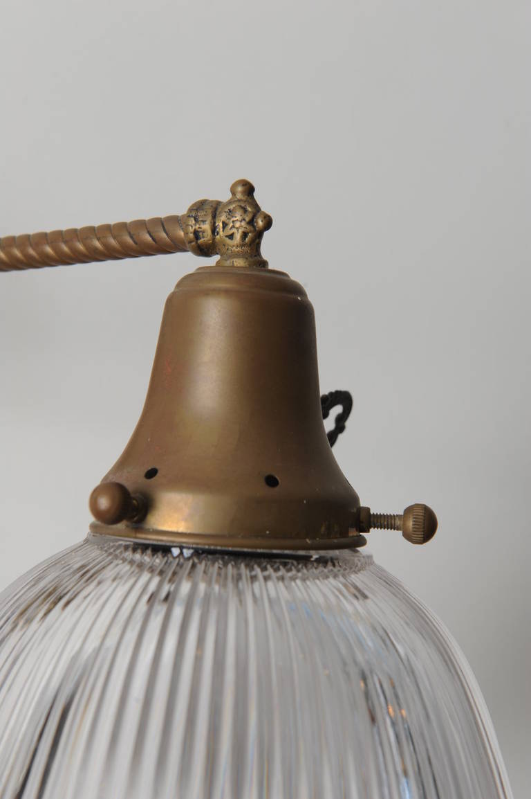 Pair of Brass Swing-Arm Sconces with Holophane Shades