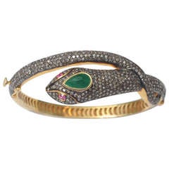 Pave` Diamond Snake Bracelet with Emeralds and Rubies