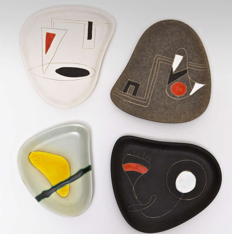 Pin trays or free form dishes. 
Earthenware glazed in black, grey or white, with engraved and overglaze polychrome decoration displays wonderfully. 

Note : The white, red, and black dish has been sold ! 

Peter and Denise Orlando pieces are