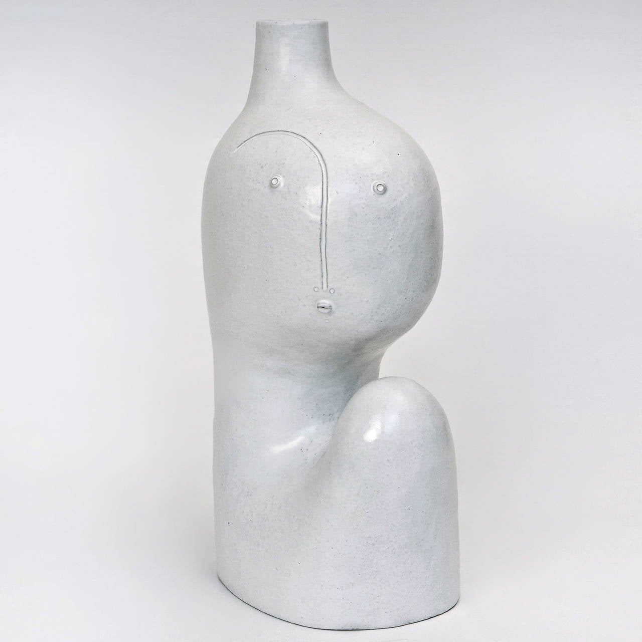 A spectacular biomorphic sculpture which can also be wired as a table-lamp ; stoneware glazed in deep milky white, forming a stylized and abstract human figure. 

Each piece signed by the DaLo, hand sculpted, is unique. 

The dimensions approx.
