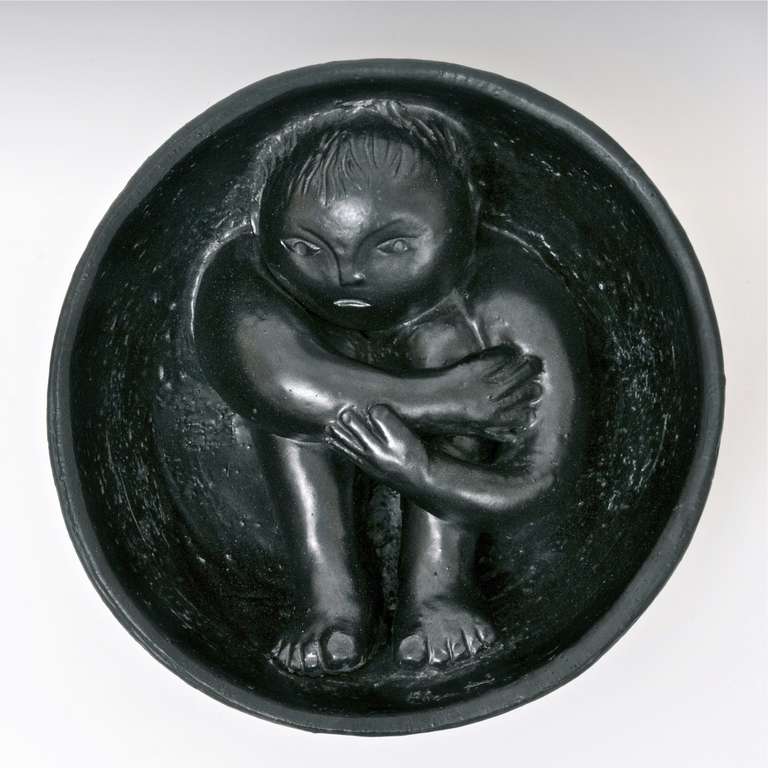 Important and heavy bowl decorated with a modeled nativity sculpture, earthenware glazed in deep black. 
A very rare piece, originally created to be hung. 

Cloutier incised and signed inside.