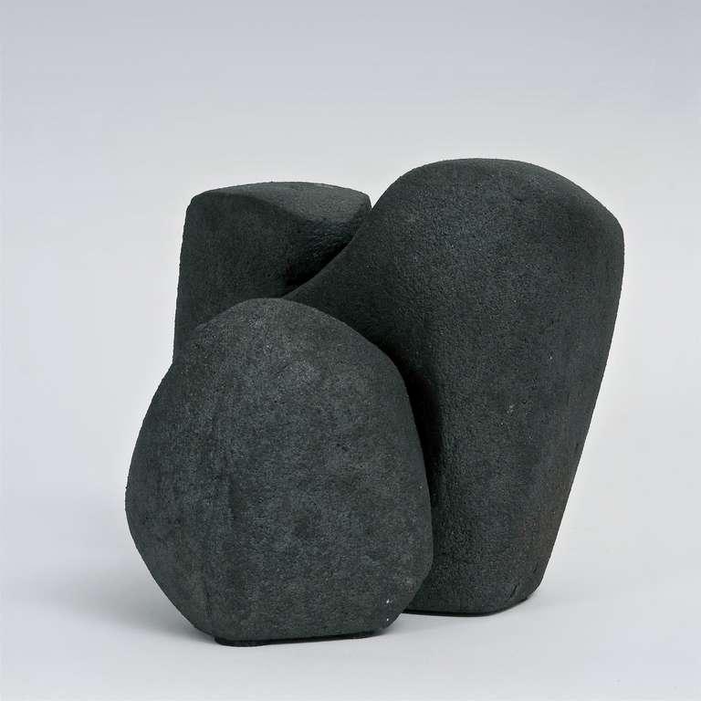 An organic form sculpture, chamotte clay with a dark and matt anthracite slip, signed by the French artist. 
A rare piece displays wonderfully from all angles views.