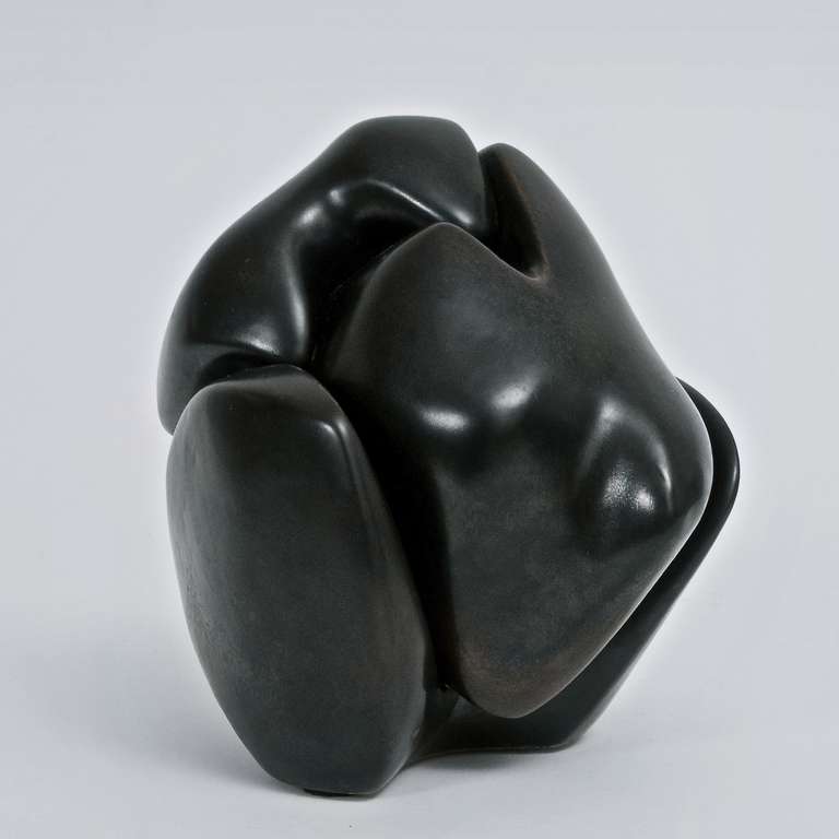 An abstract sculpture, organic form, earthenware glazed in a deep and shiny dark brown.
A rare piece displays wonderfully from all angles.