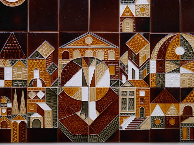 A wonderful and complete set of 27 embossed tiles, plus 20 coordinated brown, picturing a naive landscape in the "Collioure" pattern created by Roger Capron in 1972.
Thin faience with transparent glaze.

They have never been used and