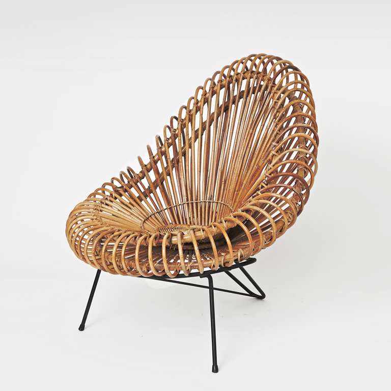 A rare and spectacular lounge chair. 
Wickerwork on black enameled steel tripod frame.

A tribute to the famous « Corolle chair » by Janine Abraham and Dirk-Jan Rol, or often attributed to Franco Albini.
Italy, circa 1960’s.