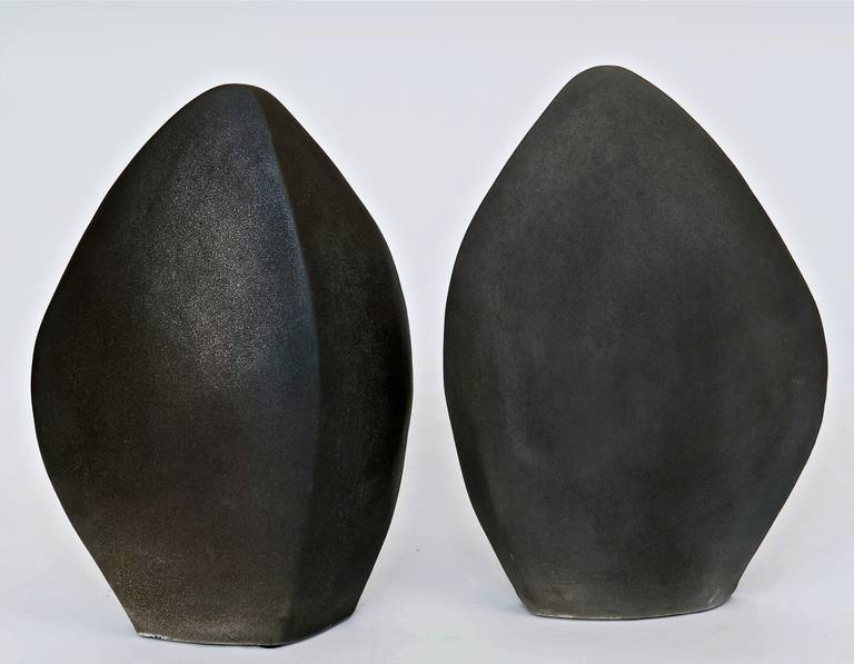 A rare pair of ceramic sculptures, in complementary and subtitle shades of warm grey color glazes and slips on porcelain base.

Note: Dimensions approx are for one piece.

Please visit our storefront to discover other available pieces by the