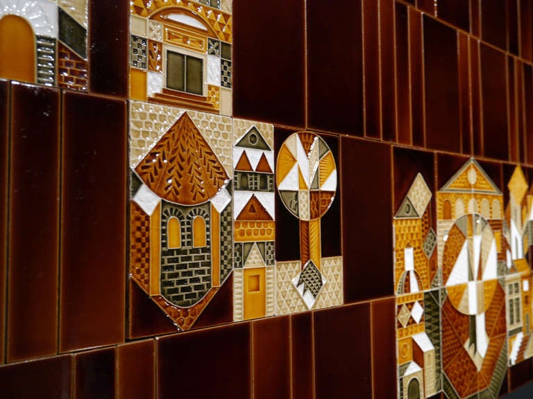 A wonderful and complete set of 27 embossed tiles, plus 85 coordinated brown (extra pieces are available on request), picturing a naive landscape in the "Collioure" pattern created by Roger Capron in 1972.
Thin faience with transparent