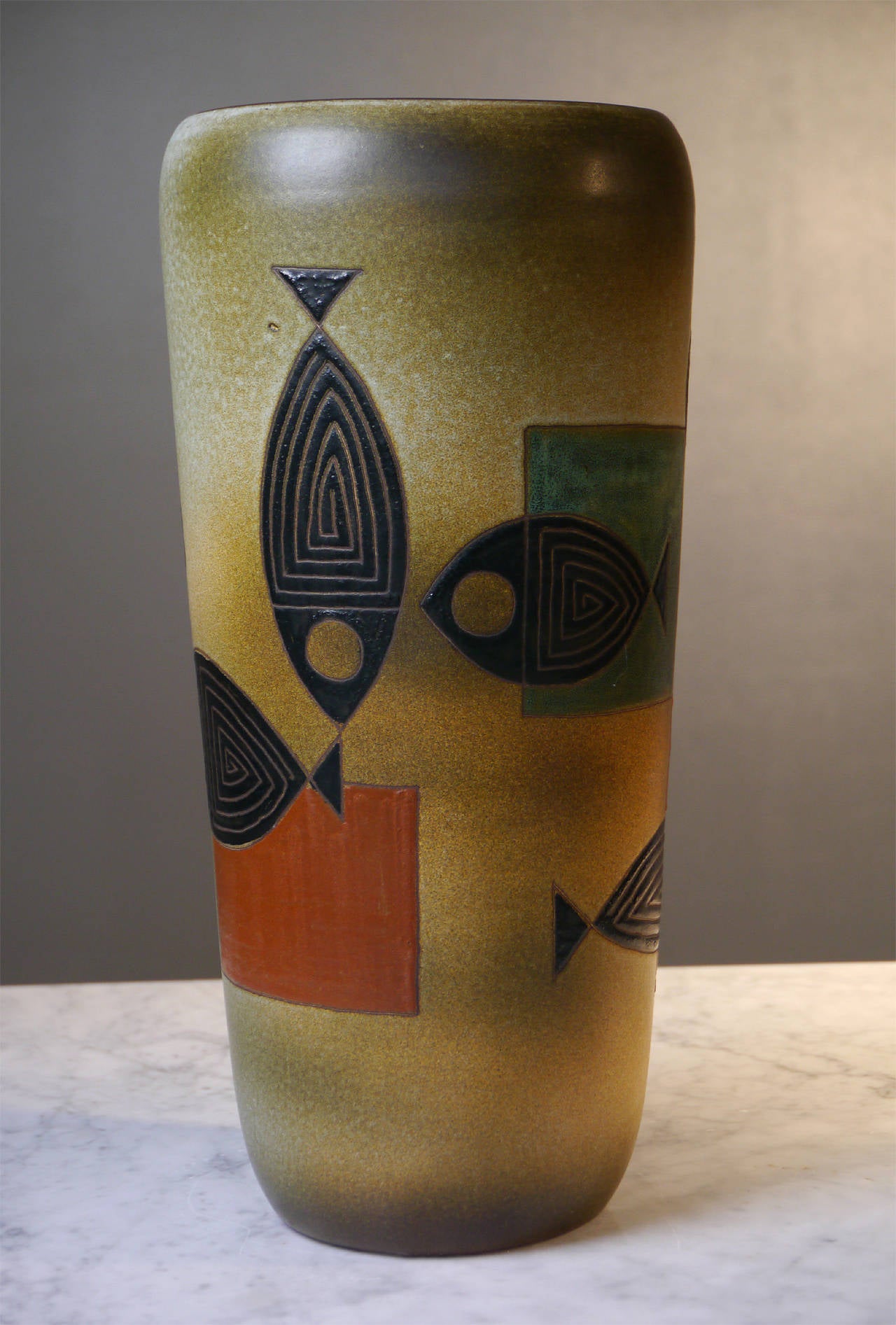 René Maurel's work is renowned to be really singular in the post-war Ceramic
School of Vallauris. 

Perfect enamel glazes, enhanced with his typical sgraffito technic which had probably a great influence on one of his more famous guest,