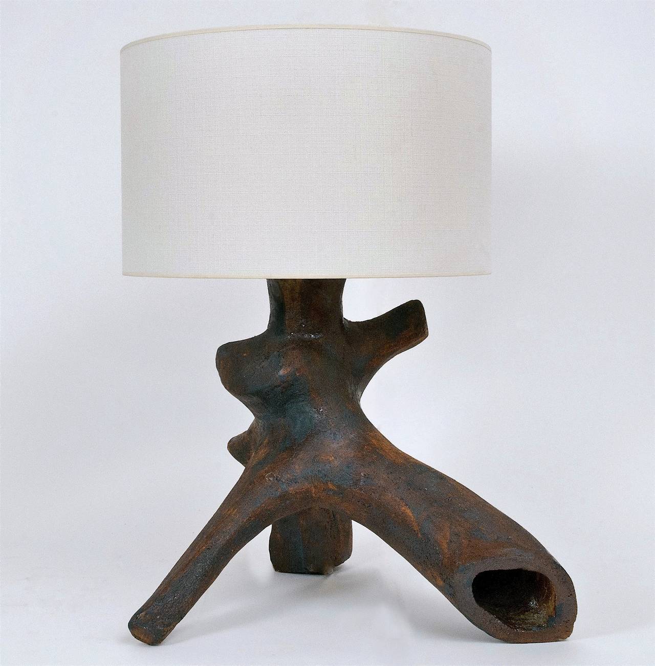 Impressive floor lamp-base (or extra large table lamp) in grogged clay with warm and patinated glaze and slip, forming a tree trunk sculpture.

* Dimensions approx. are without the lamp-shade
Very heavy piece. 

Note : This piece displayed has