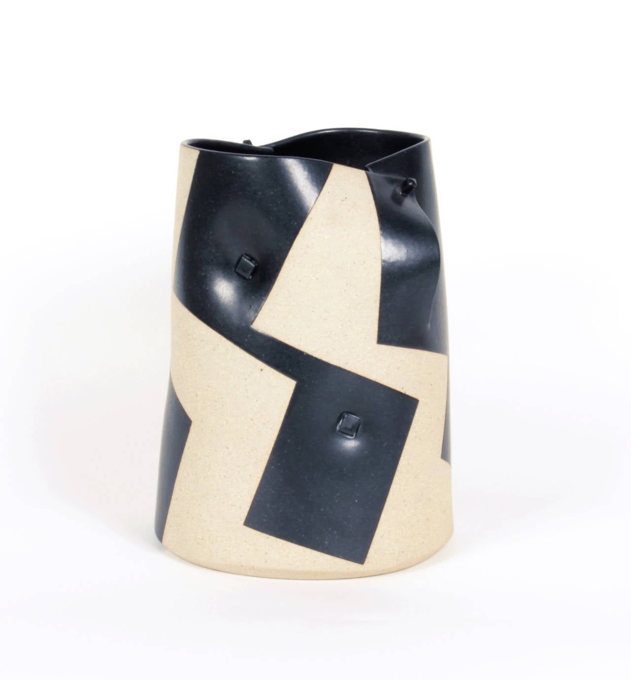 Gustavo Perez, Mexico.

Stoneware vase, 2000.

Black, randomly positioned rectangles on a cream / sandy base with a pinned overlap detail. 

Signed: GP 2000-68.

Dimensions: H: 9 1/4