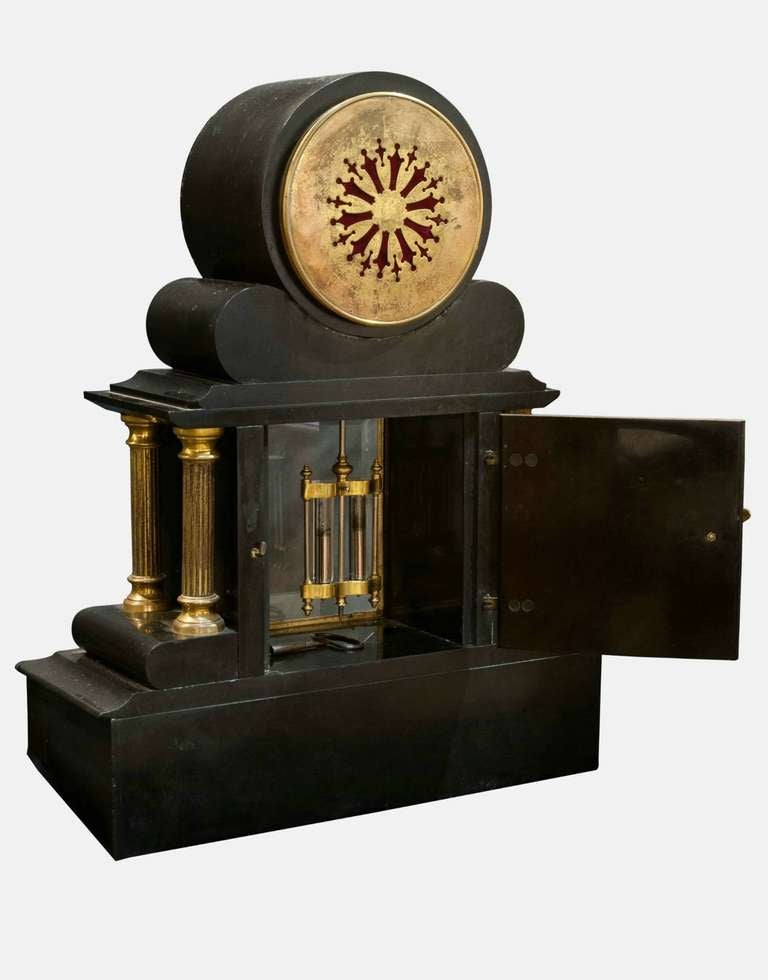 A French, 19th century marble and slate mantel clock and garniture with ormolu mounts.