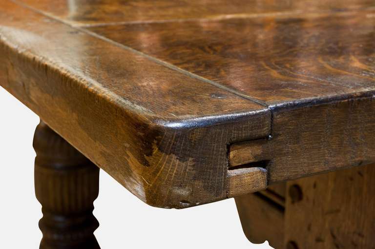 A very large early 20th Century solid oak Tudor style refectory table  with 'H' stretcher.