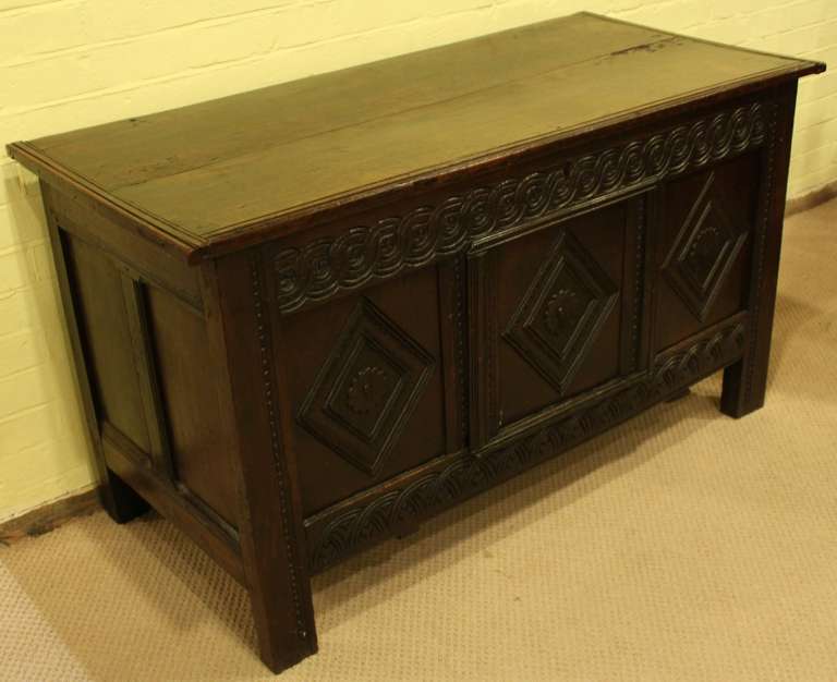 Charles II oak coffer with original floret carving, indistinctly stamped with the letter 'A'