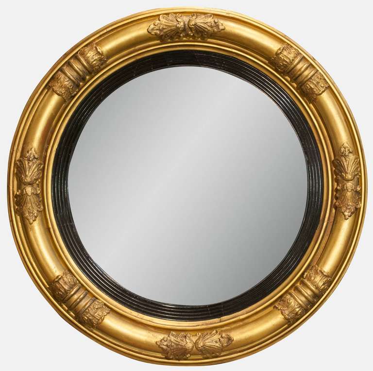 A Regency convex butlers or bullseye mirror of superior quality and good proportions