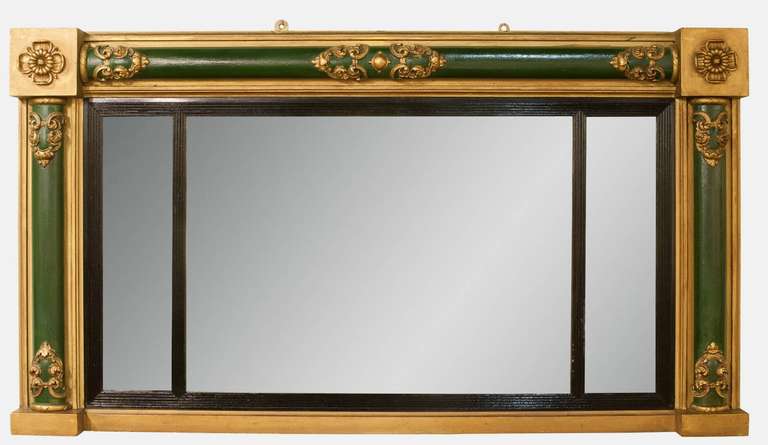 A Regency triple plate overmantel mirror with green columns and gilt decorations