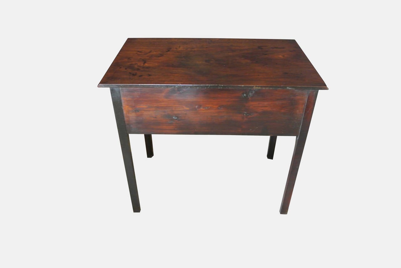 A superb quality late Georgian mahogany lowboy of good proportions, with original brass swan neck handles on square legs with two short drawers and one long.