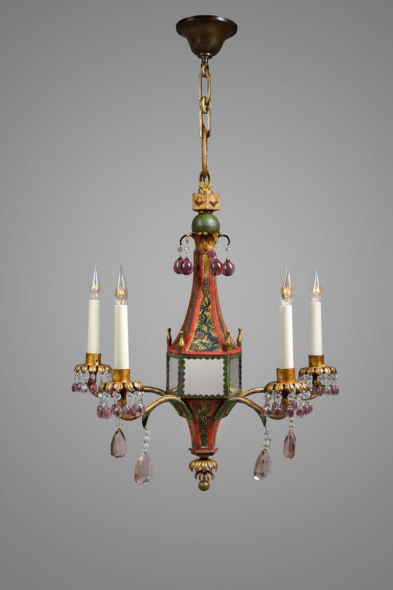 Lantern shaped chandelier
Attributed to  the Maison Baguès
France circa 1930-40
Wrought iron, iron sheet, mirrors and crystals
Polychrome oriental ornament on the central part
Five lights
