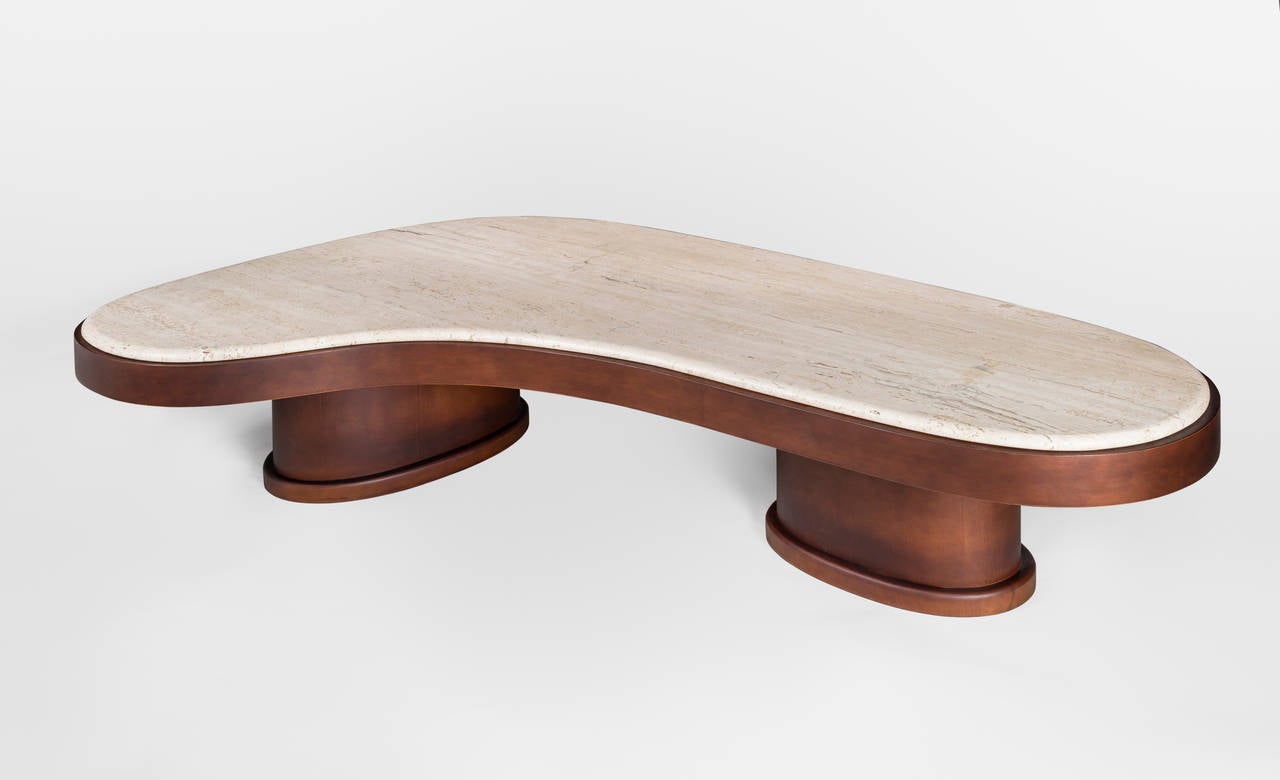 Dropp coffee table by Charles Tassin.
Travertine top, base in mahogany tinted wood.