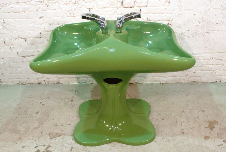 Large 1970s double-faced washbasin by Luigi Colani.
Faucets attributed to Luigi Colani.
Small covered chip at the base (see picture). 
Number-and-letter code on inside (see picture)