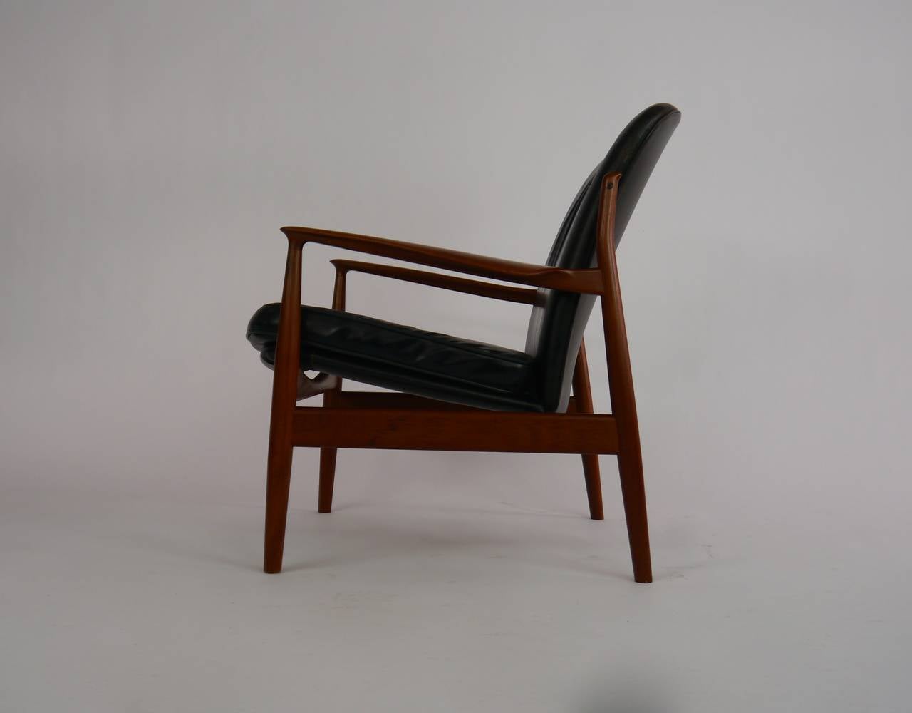 Fauteuil de salon en teck et cuir de Finn Juhl pour France et Daverkosen