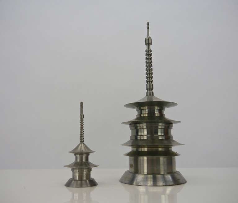 Vintage hand machined nesting maquettes of two Japanese Shrines. The smaller of the two fits inside the larger and the lid can be replaced. Illegibly signed to the bottom with the name of the shrine and the person they were presented to.