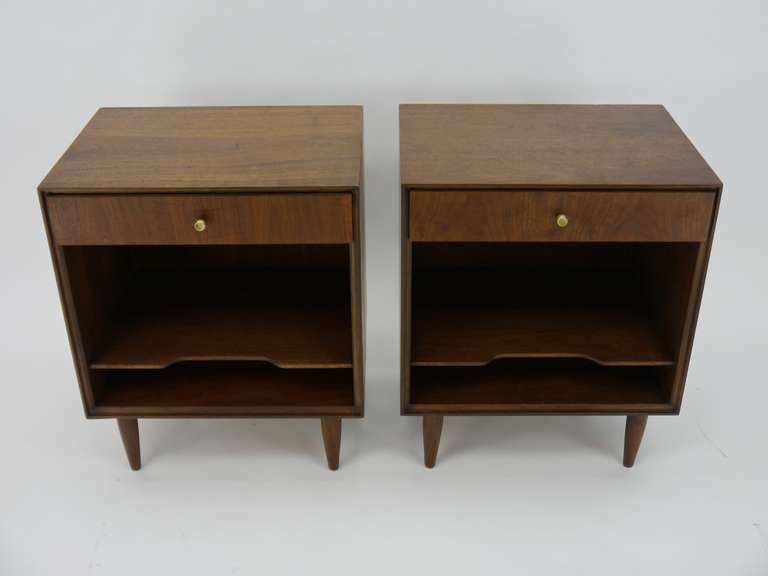 Pair of Walnut nightstands. Imported by John Stuart.  John Stuart imported fine furniture from Denamrk  and represented designers such as Peter Hvidt. The cases show nicely figured sap grain walnut.