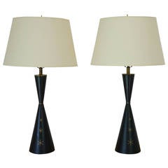 Elegant leather wrapped mid century lamps in the manner of Tommi Parzinger.