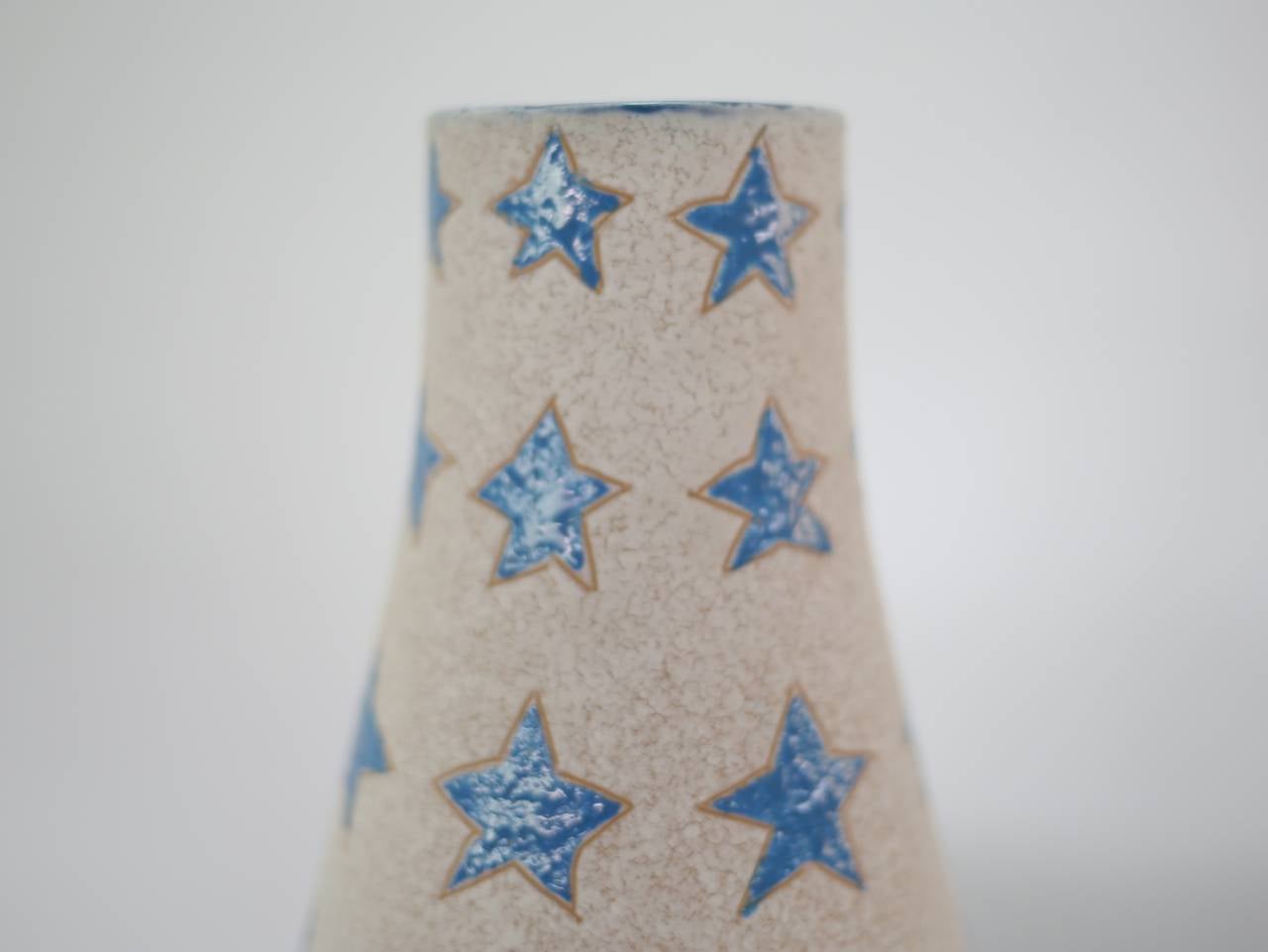 Italian Pop Art vase. Having a lava glaze surface with blue stars. Marked 