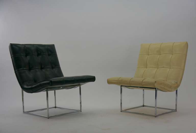 Pair Milo Baughman lounge chairs. Having chromed cube bases and a tufted scoop seat. Labeled Thayer Coggin.