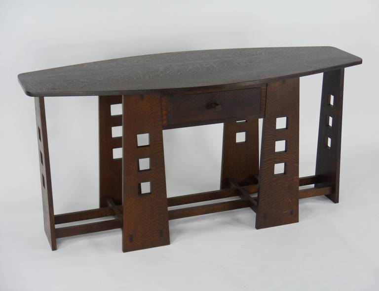 Console table in oak designed by C. R. Mackintosh for the Glasgow School of Art, circa 1907.

This exact replica handmade by Coly Vulpiani of Kingston NY, circa 1980.

Having quarter sawn oak, fine construction and meticulous attention to