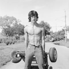 Vintage Young Man Pulling a Go-Kart