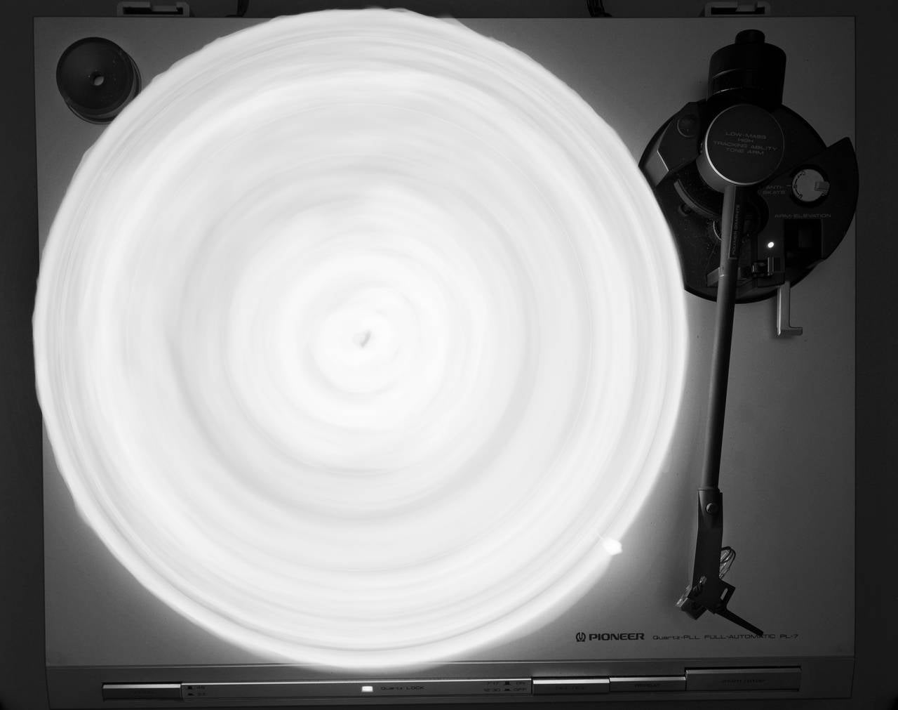 Caleb Charland Black and White Photograph - Turn Table With Candle