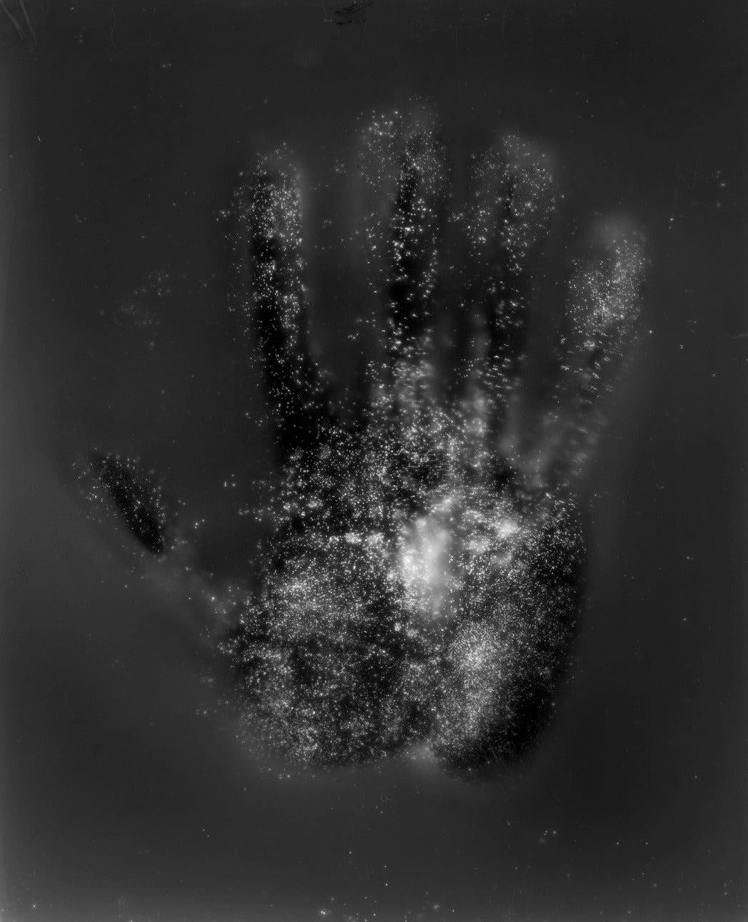 Caleb Charland Color Photograph - My Hand with Glow in the Dark Powder
