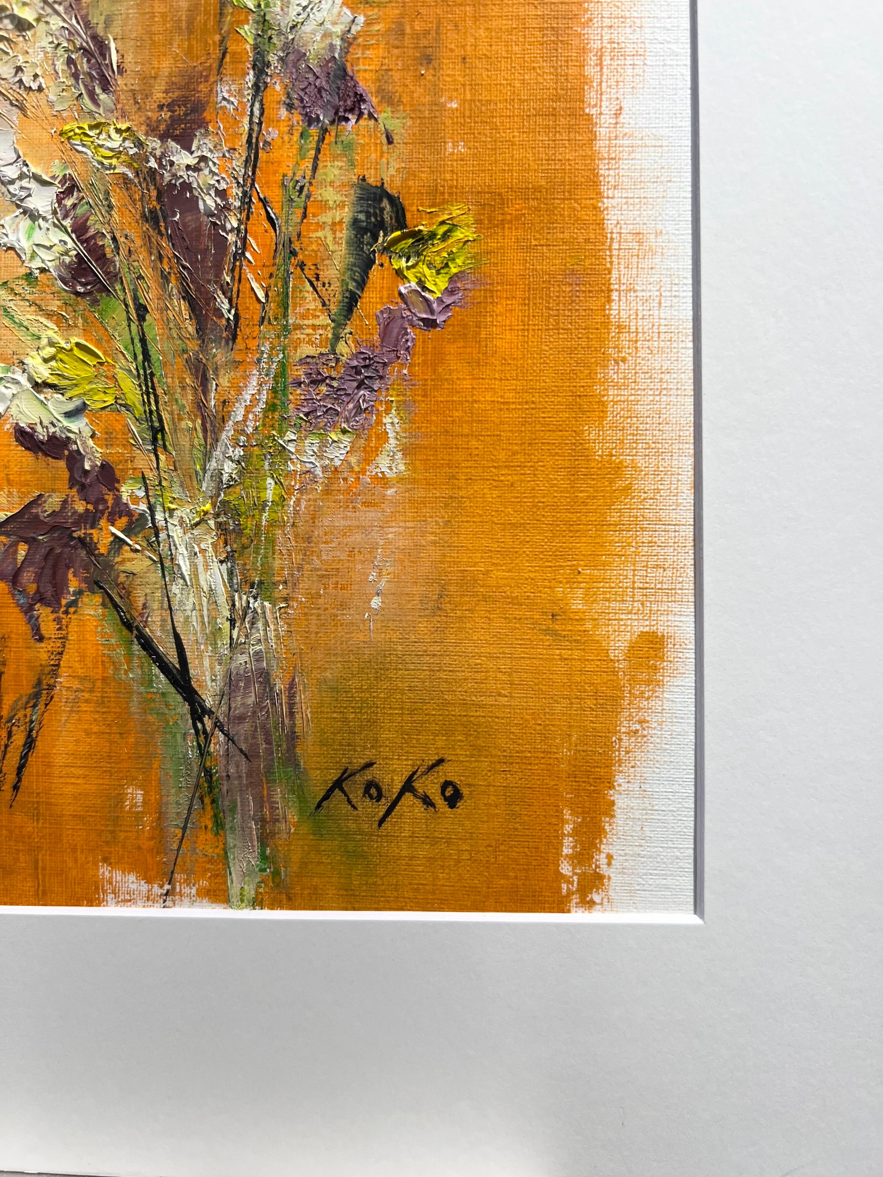 This vibrant composition showcases a delicate selection of white, yellow, and purple flowers set against a bold orange background. Green lines flow naturally through the piece, adding a sense of movement and harmony. Koko’s signature style