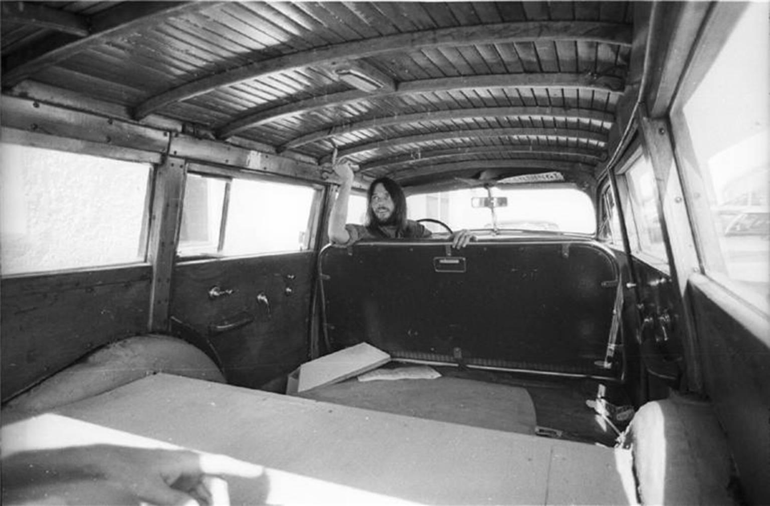 Henry Diltz Black and White Photograph - Neil Young in Car, 1971