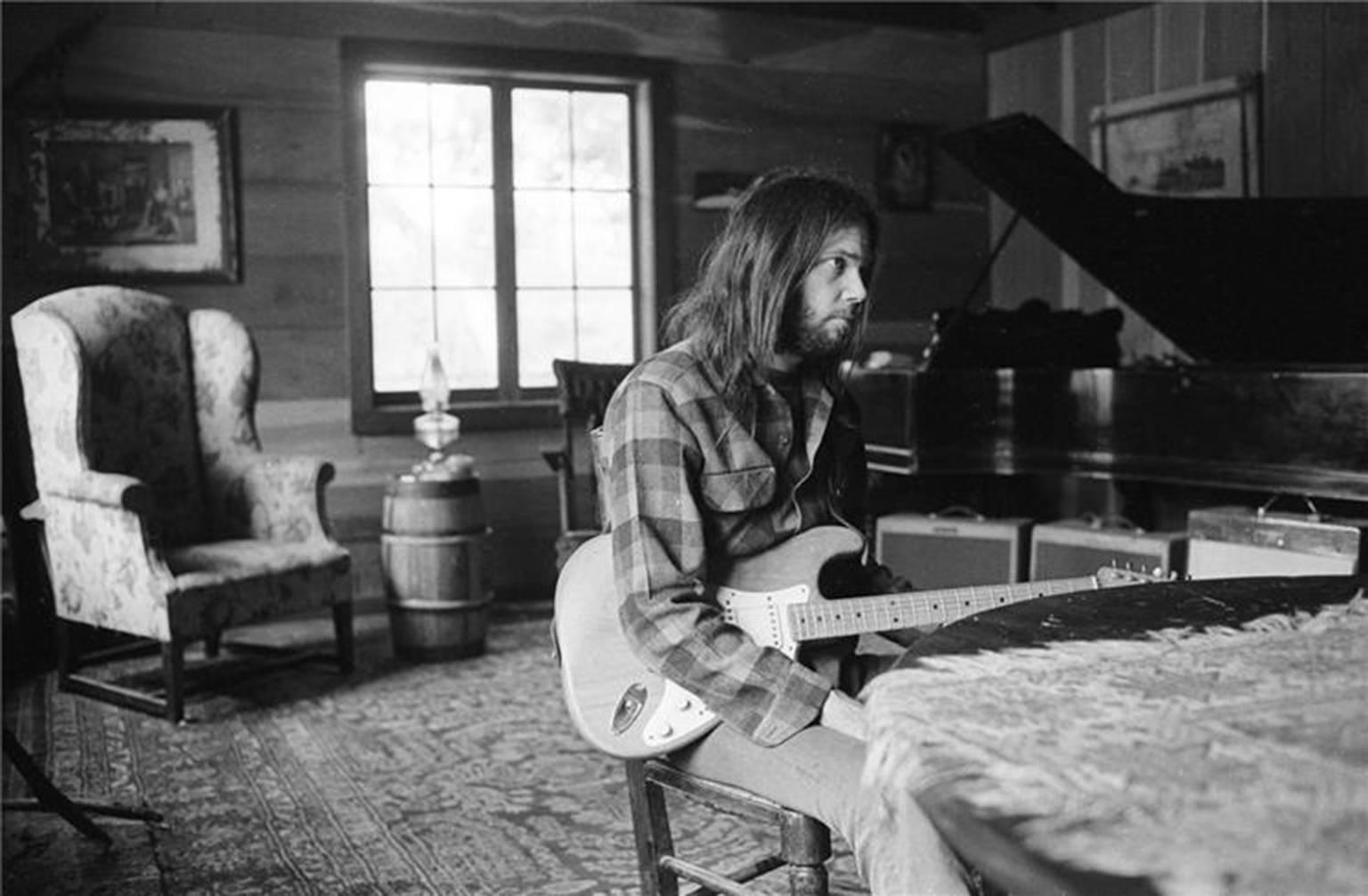 Henry Diltz Black and White Photograph - Neil Young at Piano, 1971