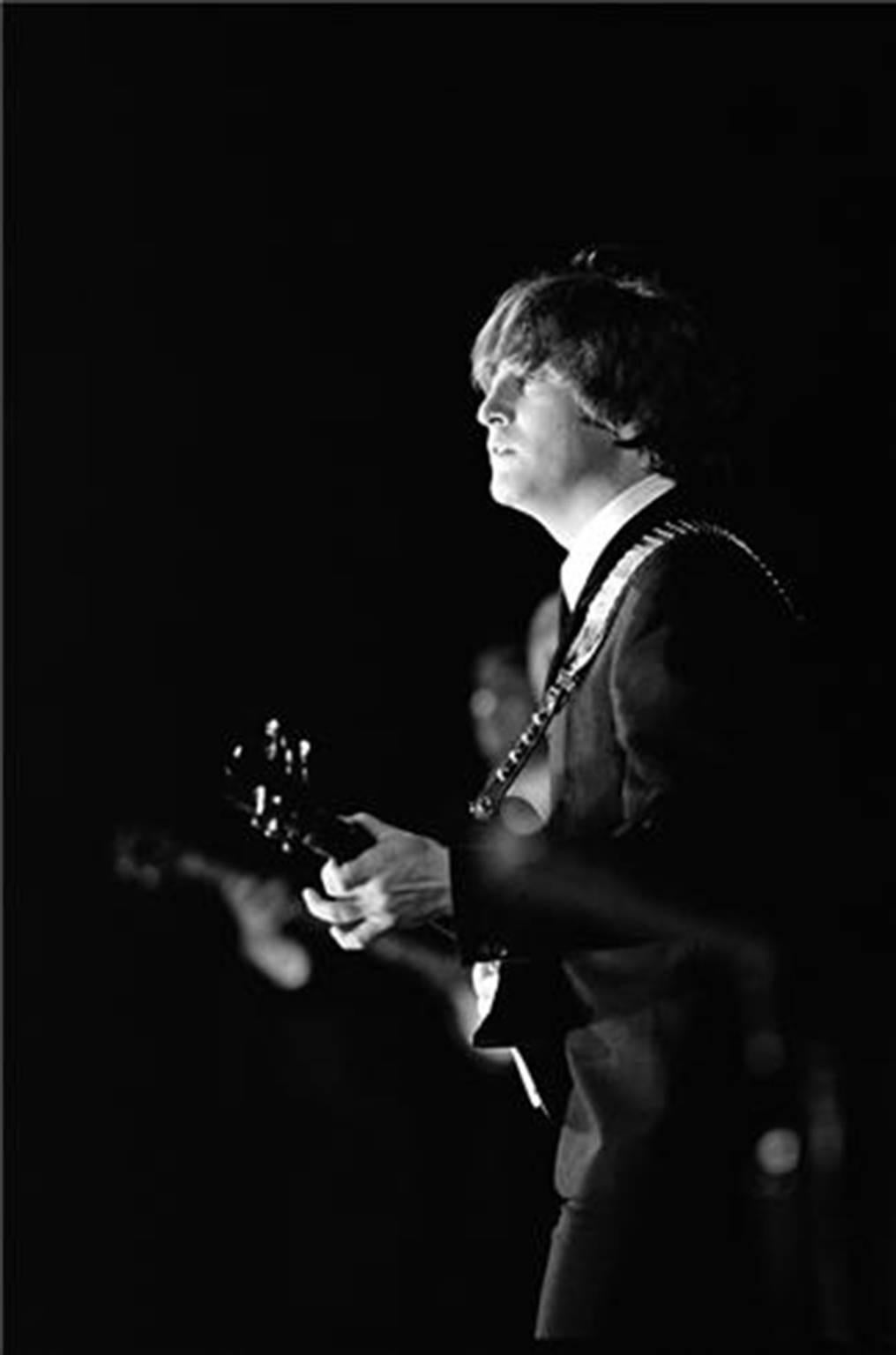 Curt Gunther Black and White Photograph - John Lennon on Stage