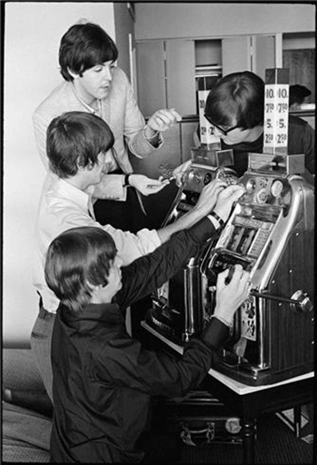 Curt Gunther Black and White Photograph - The Beatles on a Slot Machine
