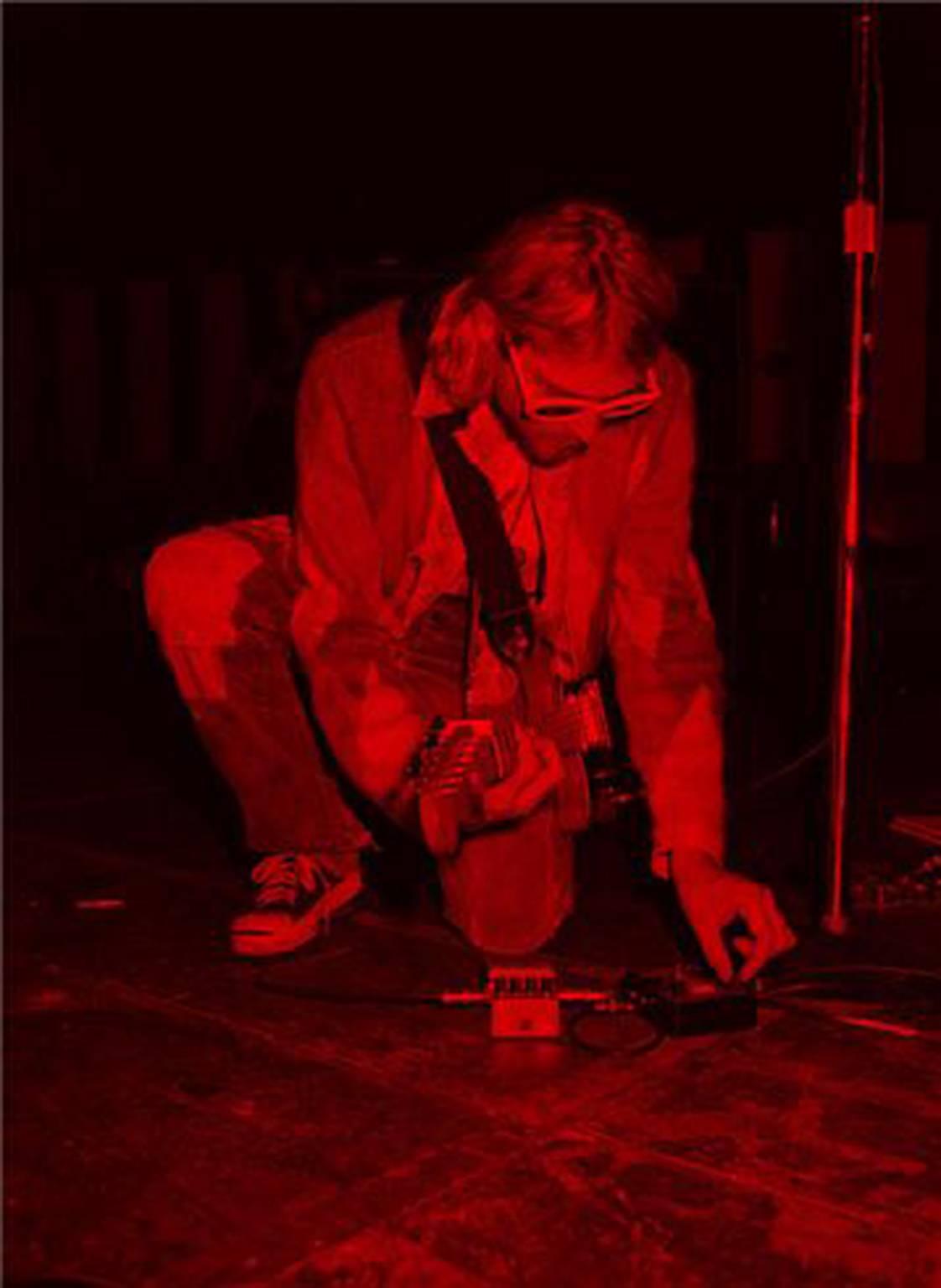 Jesse Frohman Portrait Photograph - Kurt Cobain; Kneeling, Red