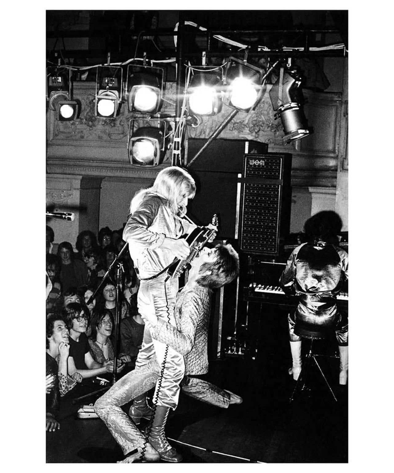 Mick Rock Black and White Photograph - David Bowie and Mick Ronson, 1972