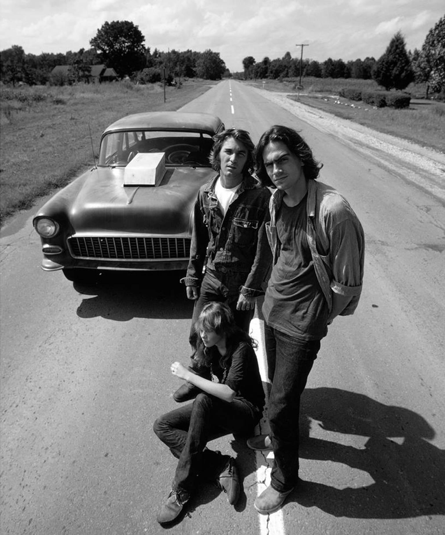 John R. Hamilton Black and White Photograph - James Taylor, Dennis Wilson and Laurie Bird, “Two-Lane Blacktop, ” 1971