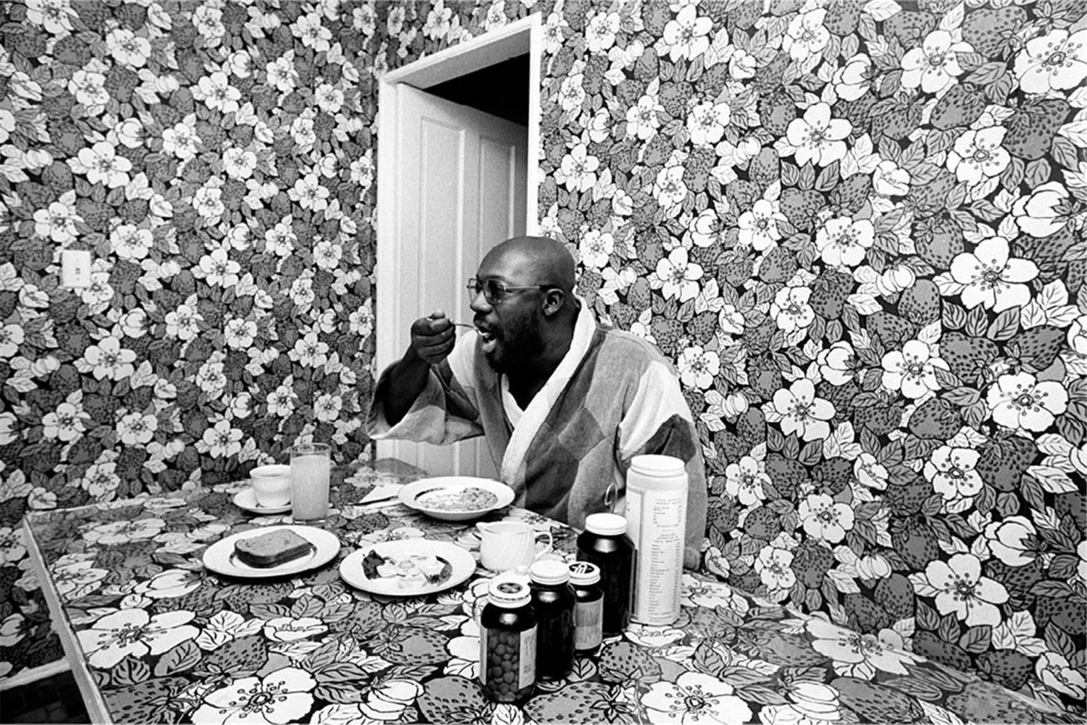 John R. Hamilton Black and White Photograph - Isaac Hayes, breakfast nook at home, Los Angeles, California, 1971