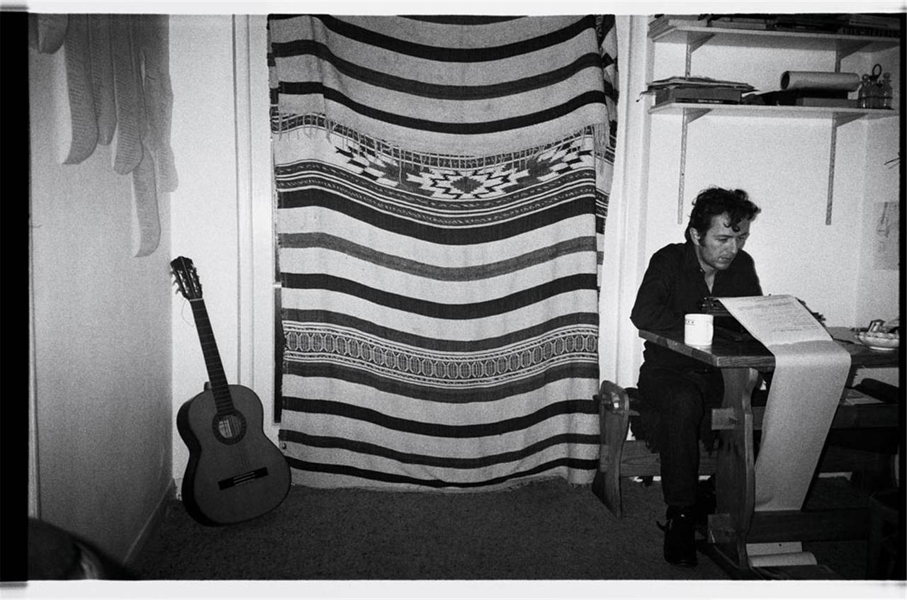 Josh Cheuse Portrait Photograph - Joe Strummer at Typewriter
