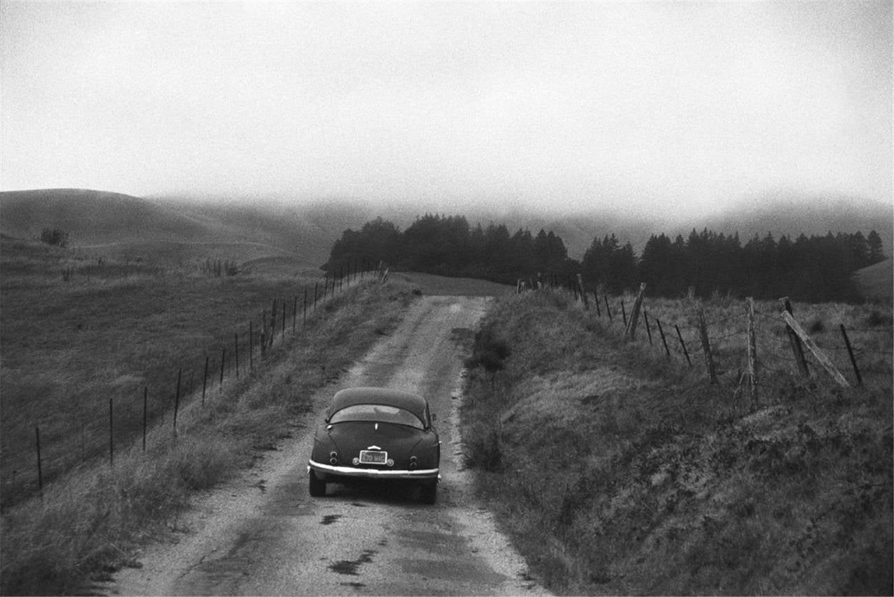 Graham Nash Landscape Photograph – Neil Young Driving Home