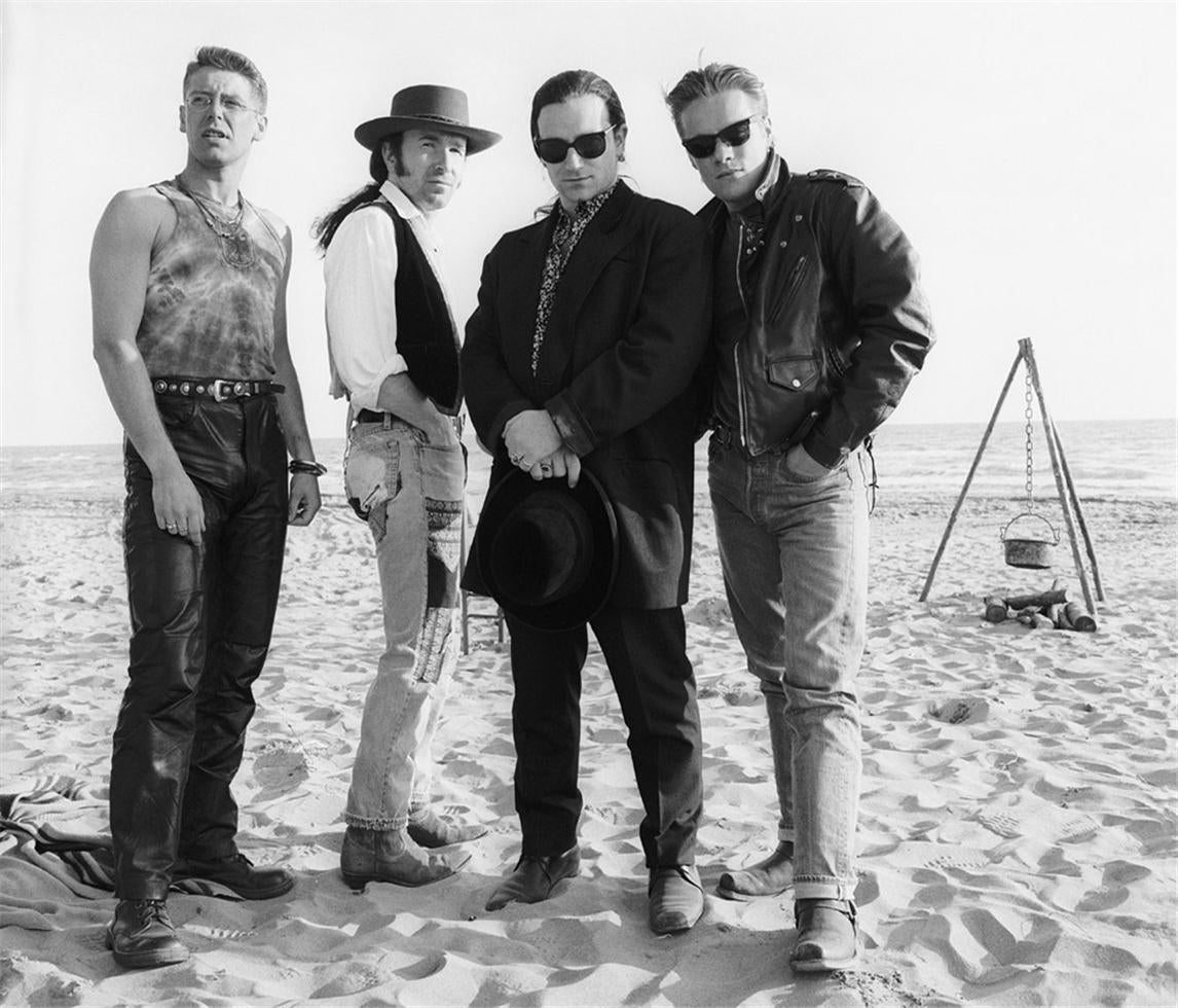 Colm Henry Black and White Photograph - U2, Ostia Beach, Rome, 1989