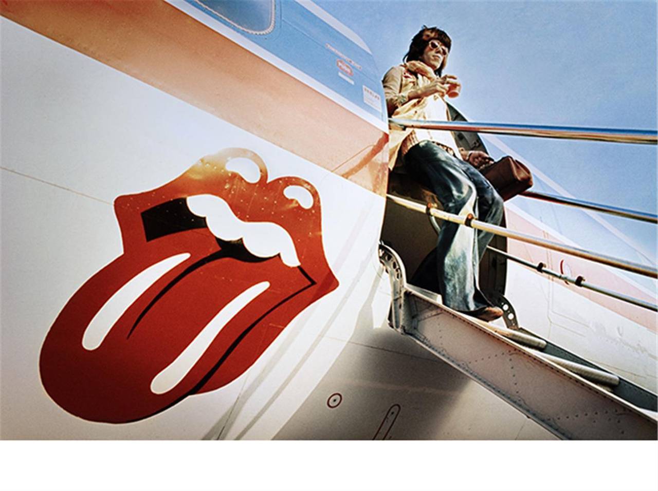 Ethan Russell Color Photograph - Keith Richards exits the "Starship" 1972 US Tour