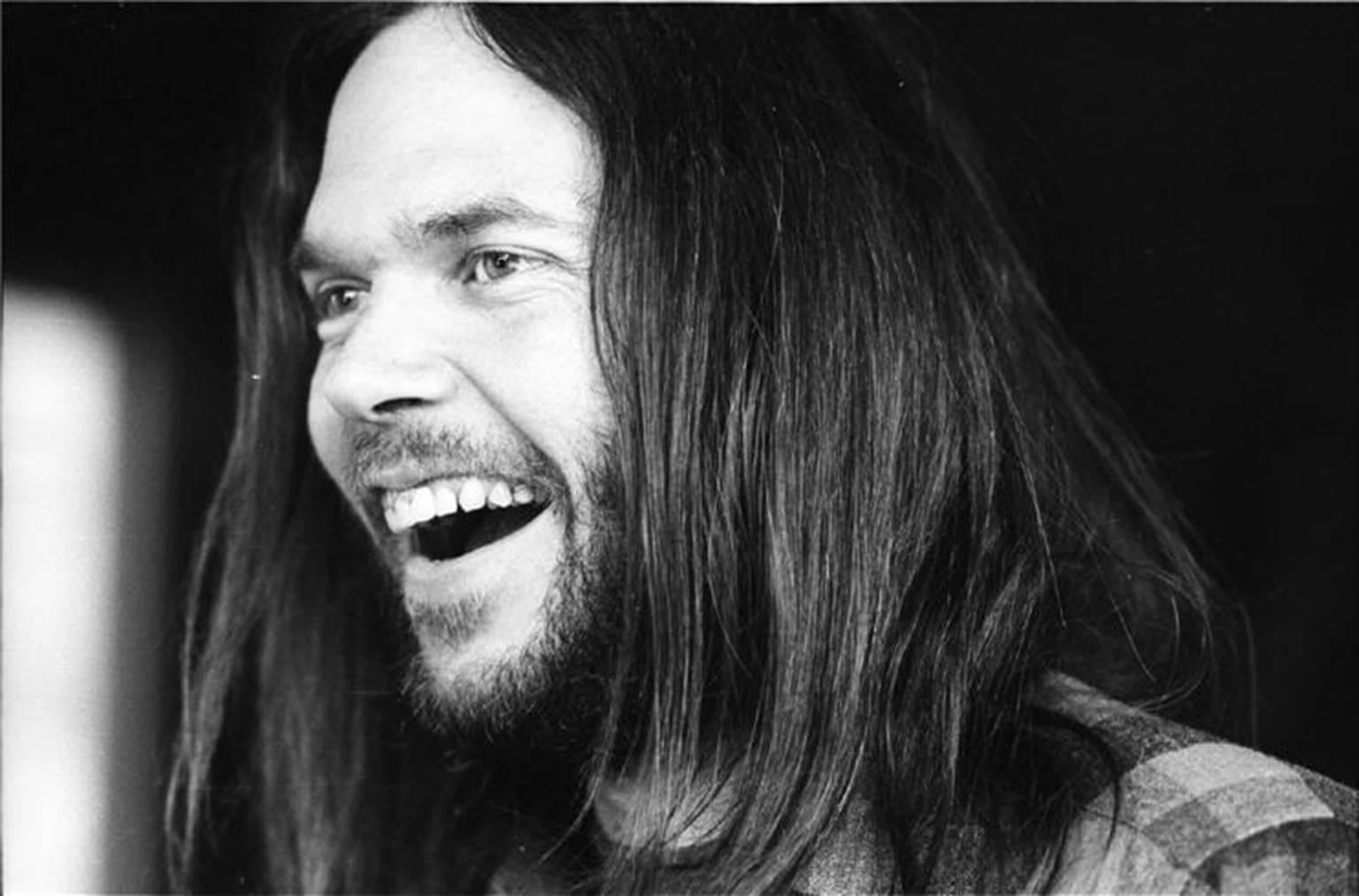 Henry Diltz Black and White Photograph - Neil Young Laughing, 1971